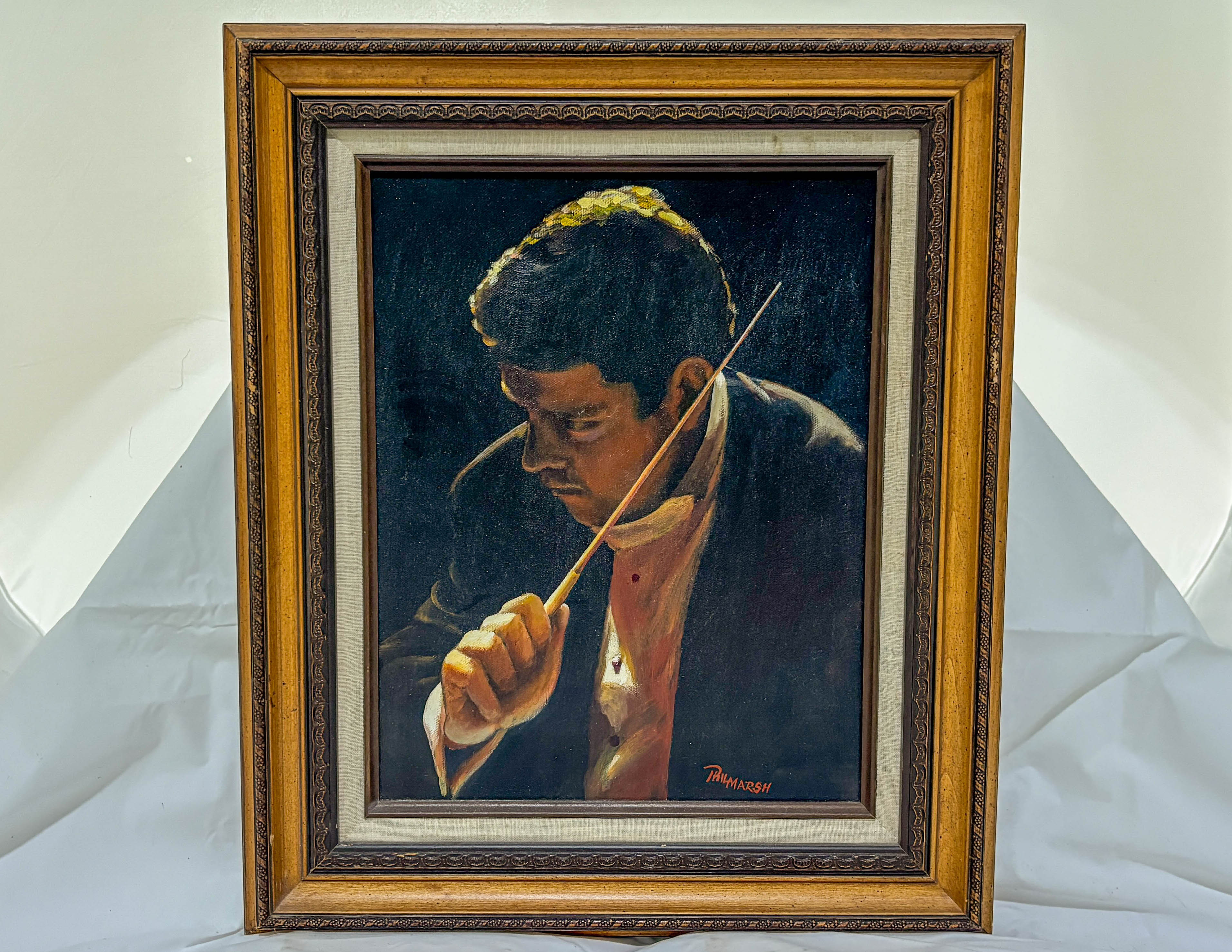 Framed painting of a person holding a stick
