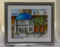 Framed artwork of a building with a blue dome