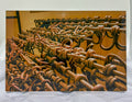 Rust-covered metal hooks on a yellow background