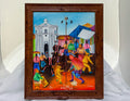Framed colorful painting of a lively street scene with people and buildings.